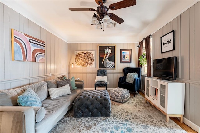 living room featuring light hardwood / wood-style floors and ceiling fan