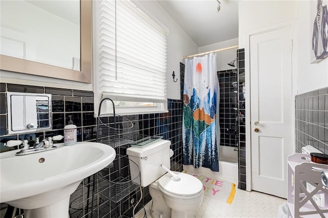 full bathroom with sink, tile walls, shower / bath combination with curtain, tile patterned flooring, and toilet