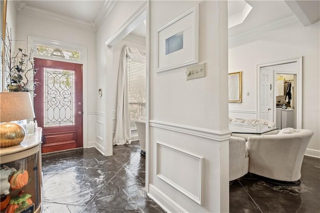 2021 W Ridge Dr, Mandeville, LA 70448 - foyer featuring dark marble finish flooring, wainscoting, crown molding, and a decorative wall