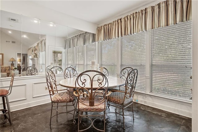 2021 W Ridge Dr, Mandeville, LA 70448 - dining space featuring finished concrete floors and plenty of natural light