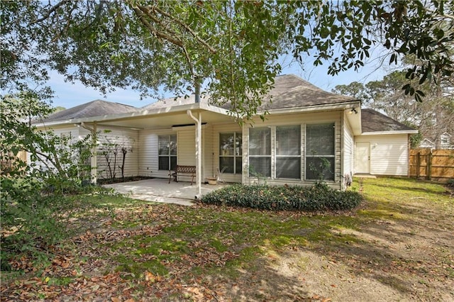 2021 W Ridge Dr, Mandeville, LA 70448 - rear view of house with a patio area and a shingled roof