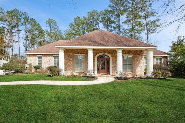 view of front of property with covered porch and a front yard