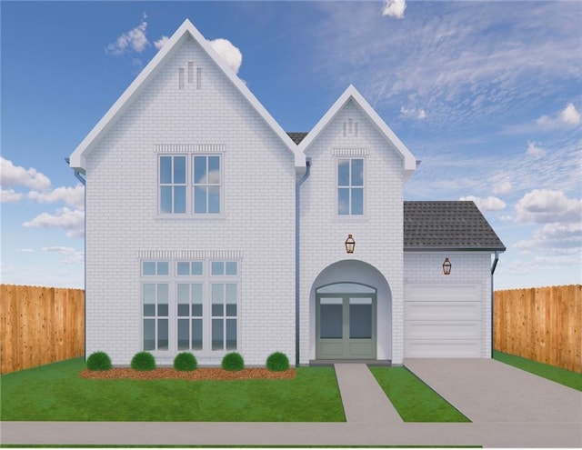 view of front facade with driveway, fence, a front yard, and an attached garage