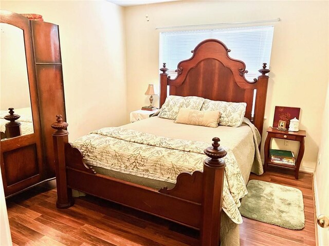 bedroom featuring wood finished floors