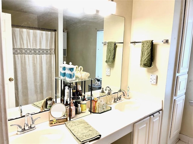 bathroom featuring vanity and a shower with curtain