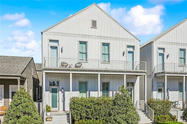 view of front of house with a balcony