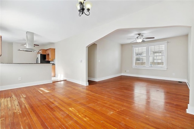 unfurnished living room featuring light wood-type flooring and ceiling fan