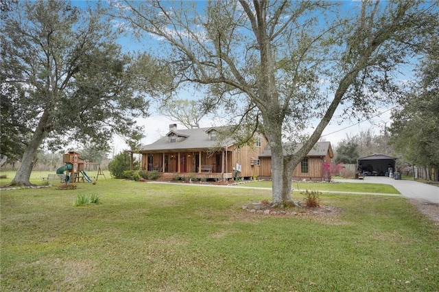 view of front of property with a playground, covered porch, and a front lawn