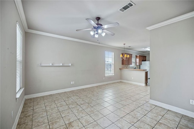 spare room with ceiling fan with notable chandelier, light tile patterned floors, and ornamental molding