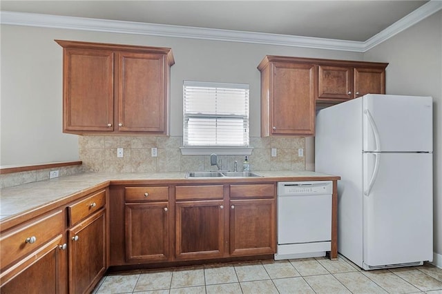 kitchen featuring sink, white appliances, crown molding, and backsplash