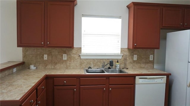 10600 Lakes Blvd Unit 901, Baton Rouge, LA 70810 - kitchen with white appliances, decorative backsplash, a sink, and light countertops