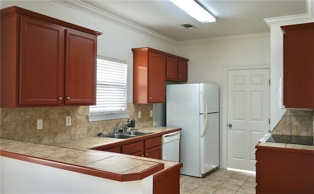 10600 Lakes Blvd Unit 901, Baton Rouge, LA 70810 - kitchen with a sink, white appliances, crown molding, decorative backsplash, and light tile patterned floors