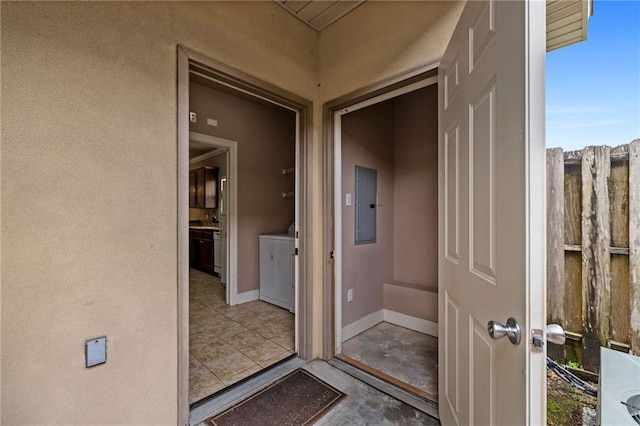 exterior space featuring electric panel and washer / clothes dryer