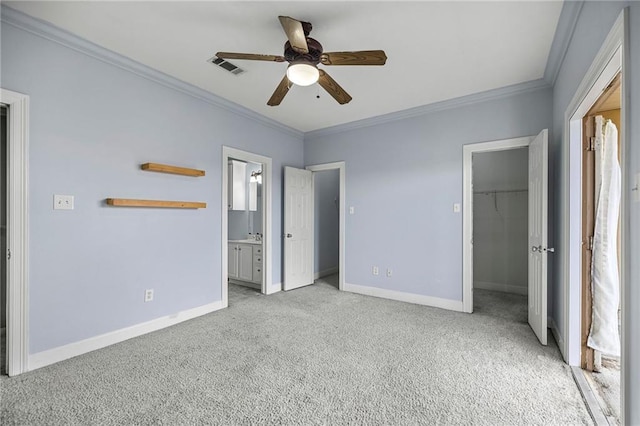10600 Lakes Blvd Unit 901, Baton Rouge, LA 70810 - unfurnished bedroom with light colored carpet, ornamental molding, baseboards, a walk in closet, and ensuite bath
