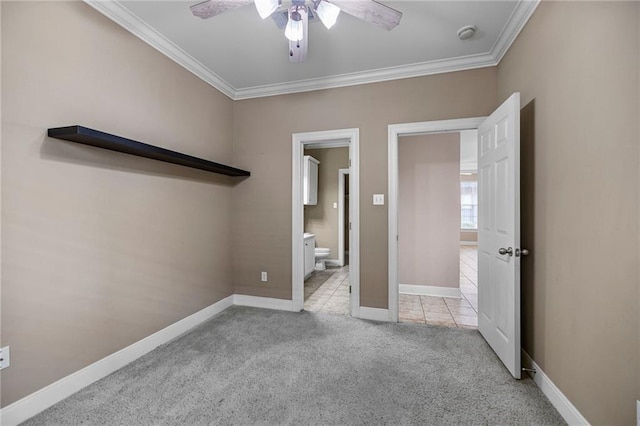 unfurnished bedroom featuring ceiling fan, crown molding, light carpet, and connected bathroom