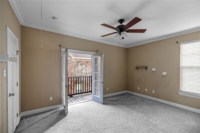 unfurnished room featuring carpet, ceiling fan, and ornamental molding