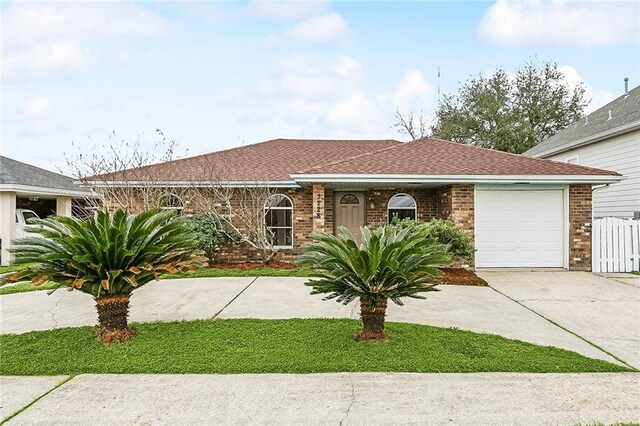 single story home featuring a garage