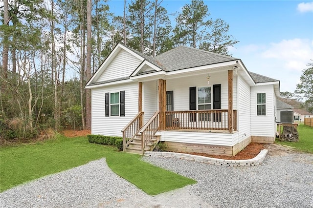 view of front of house with covered porch and a front yard