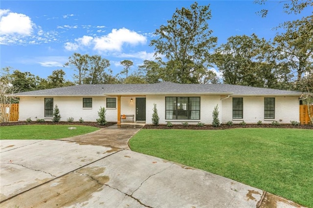 ranch-style house with a front lawn