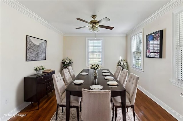 dining space with dark wood-style floors, crown molding, baseboards, and ceiling fan