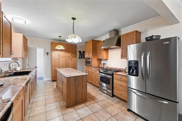 kitchen featuring appliances with stainless steel finishes, a sink, wall chimney range hood, and light stone counters