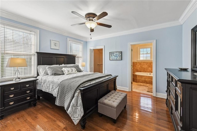 bedroom featuring baseboards, a ceiling fan, ensuite bath, dark wood-style flooring, and crown molding