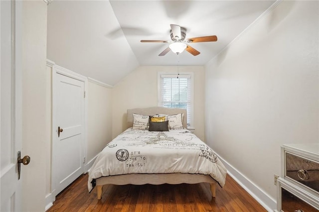 bedroom with lofted ceiling, a ceiling fan, baseboards, and wood finished floors