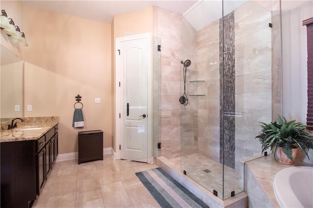 bathroom featuring vanity and shower with separate bathtub