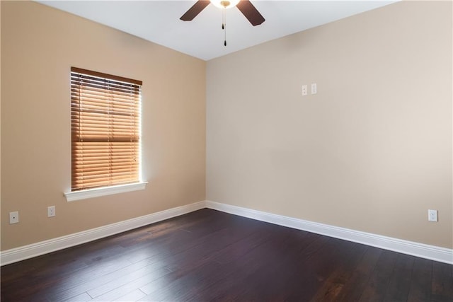 spare room featuring ceiling fan and dark wood-type flooring