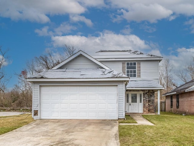 front of property featuring a front lawn and a garage