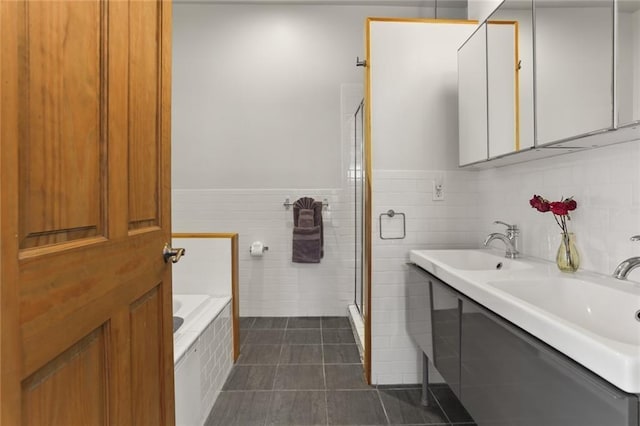 900 Delachaise St, New Orleans, LA 70115 - bathroom with independent shower and bath, tile patterned flooring, tile walls, and vanity