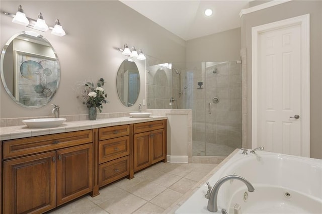 bathroom with tile patterned floors, separate shower and tub, vaulted ceiling, and vanity