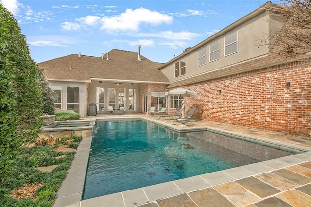 view of swimming pool featuring a patio area