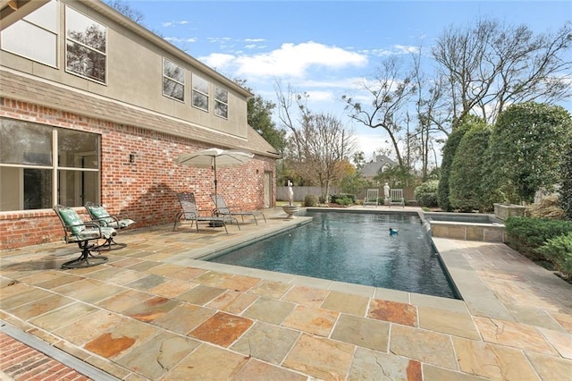 view of swimming pool with a patio area