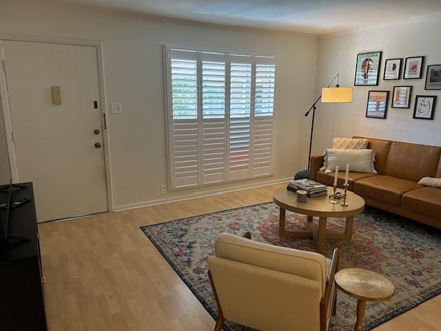 4007 St Charles Ave Unit 319, New Orleans, LA 70115 - living room featuring wood finished floors and baseboards