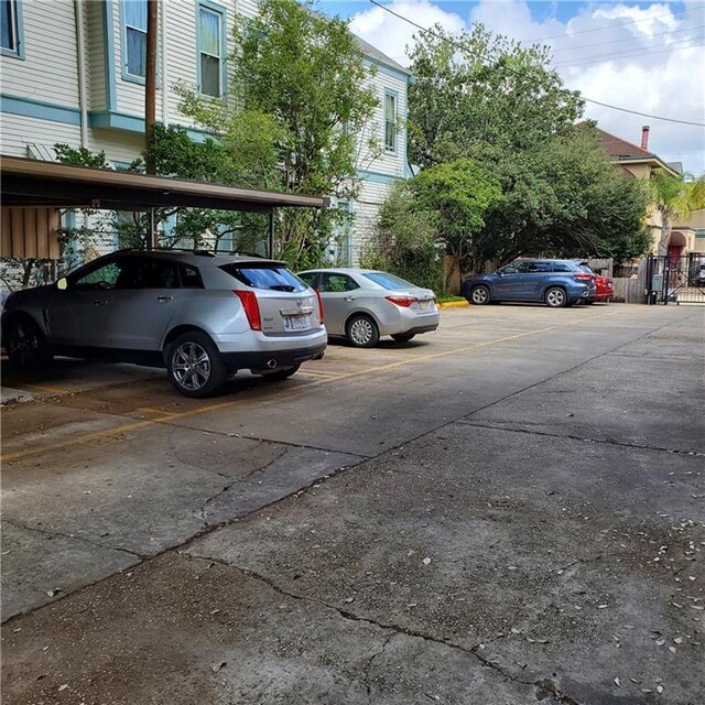4007 St Charles Ave Unit 319, New Orleans, LA 70115 - view of partially covered parking lot