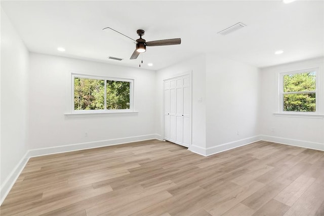 unfurnished bedroom featuring light wood-style flooring, recessed lighting, visible vents, and baseboards