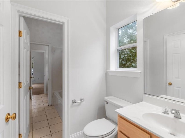 bathroom featuring tile patterned floors, toilet, and vanity