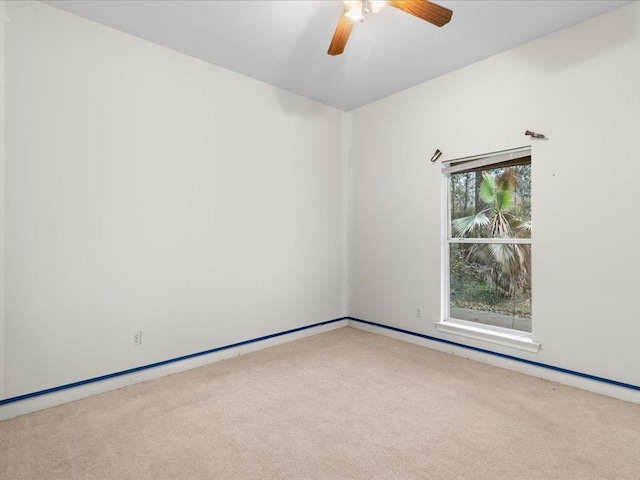 unfurnished room with carpet floors and ceiling fan