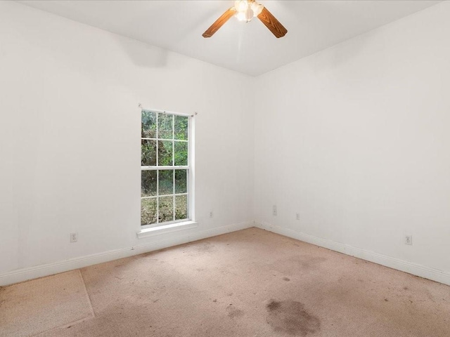 carpeted empty room with ceiling fan