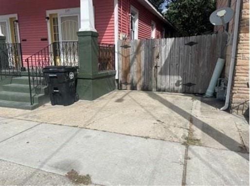 view of home's exterior with fence