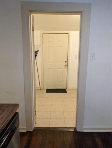 corridor featuring dark wood finished floors