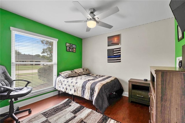 bedroom featuring dark hardwood / wood-style floors and ceiling fan