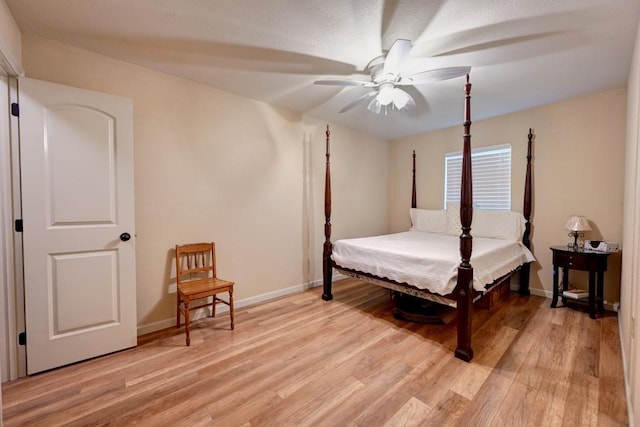 34633 W Dubuisson Rd, Slidell, LA 70460 - bedroom with light wood finished floors, baseboards, and a ceiling fan
