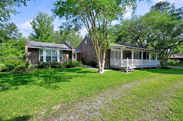 34633 W Dubuisson Rd, Slidell, LA 70460 - view of front of property with a wooden deck and a chimney
