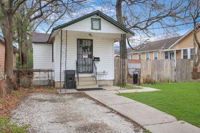 bungalow with a front yard