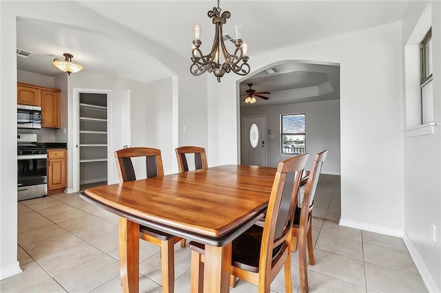 dining area with ceiling fan and light tile patterned floors