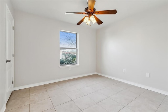 tiled empty room with ceiling fan