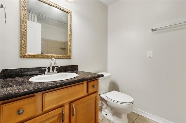 bathroom with tile patterned floors, toilet, and vanity