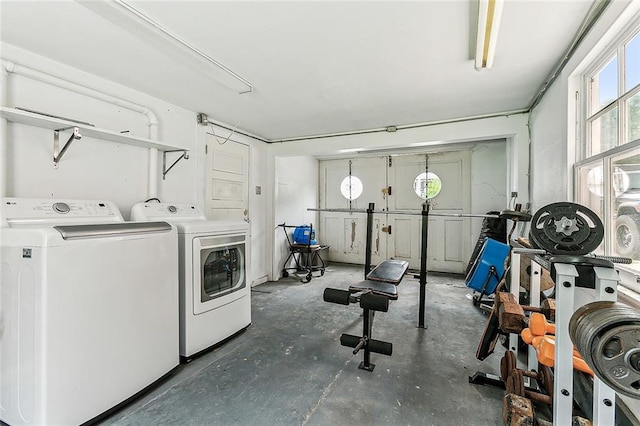 laundry room with laundry area and washing machine and clothes dryer